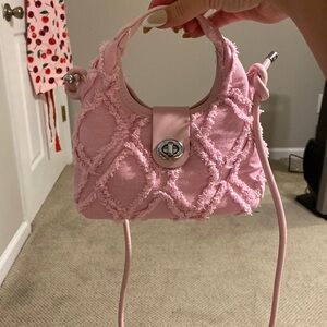 Distressed pink crossbody bag